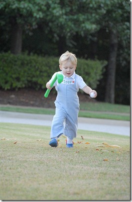 troy running with golf club