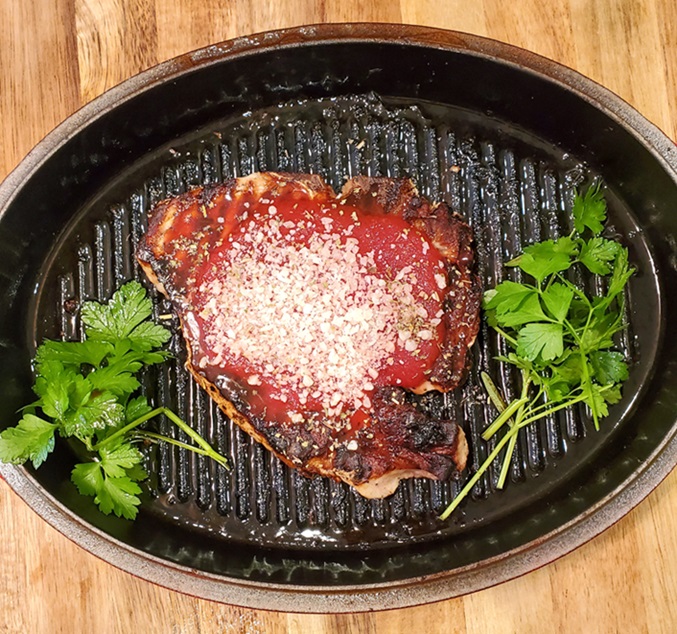 grilled pork with grated Parmesan cheese