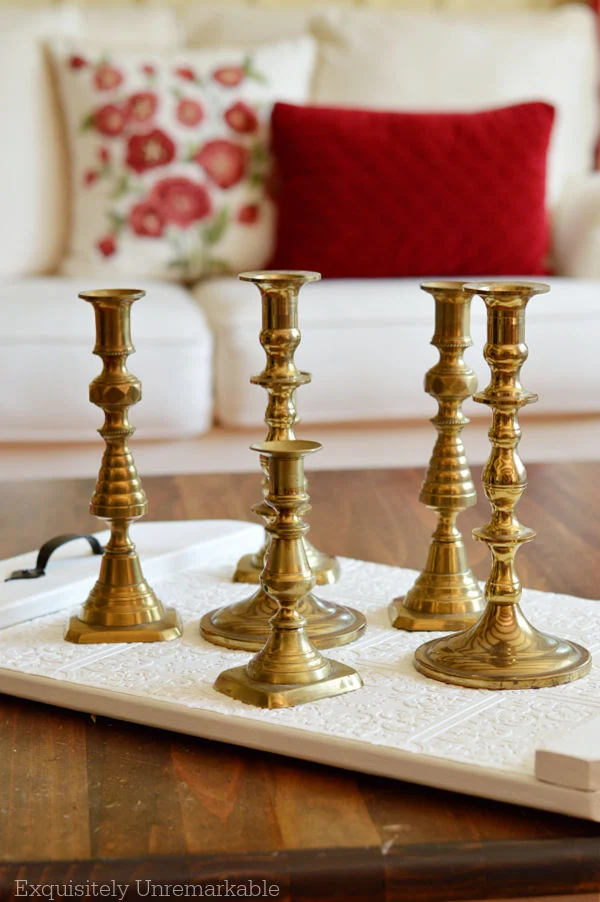 Brass Candlesticks on Wallpapered Tray