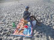 That was the beach with semihigh waves. Thats a gorgeous guy sitting at the . (santa barbara breakfast)