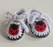 http://www.ravelry.com/patterns/library/ladybug-baby-booties