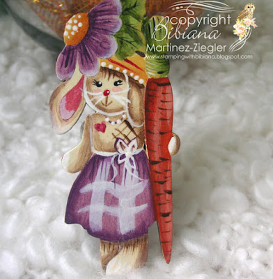 easter bunny pin holding a carrot