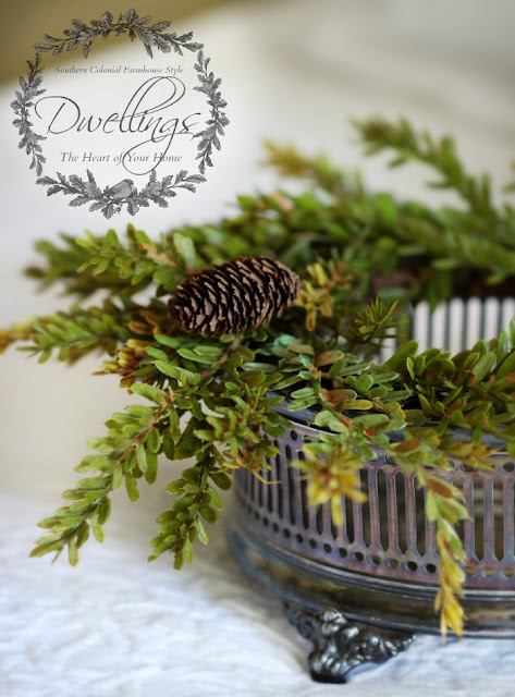 Silver dish and pine cone wreath turned candle holder for the guest room.