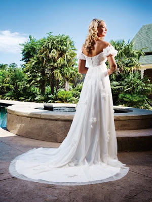 To see this or any of our other beautiful gowns please call us at 616 