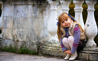 cute-girlbaby-sitting-on-the-rock