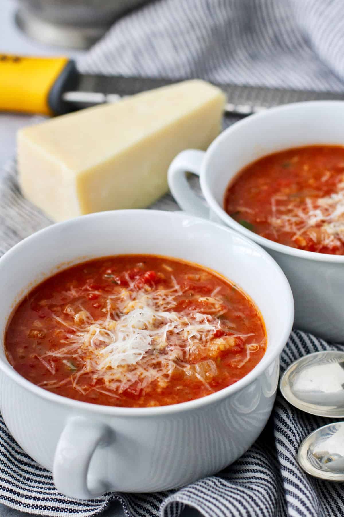 Pappa al Pomodoro (Tomato and Bread Soup) topped with cheese.