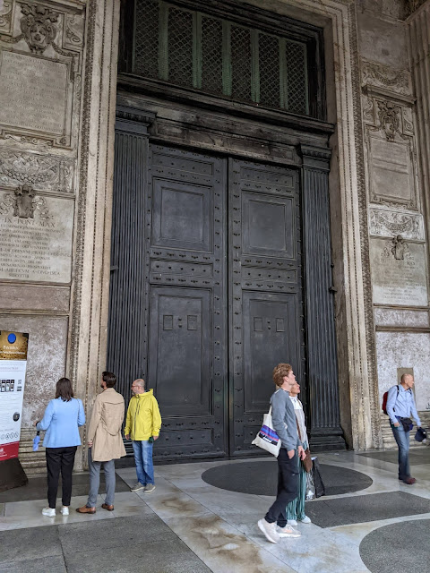 A picture of the large bronze doors of the Pantheon in Rome.