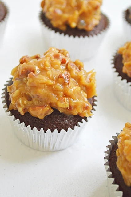 The cupcake is made with Baker's German Sweet Chocolate Bar that gives the true German Chocolate flavor.  Homemade buttery pecan coconut frosting is piled on top to complete the Iconic German Chocolate Cake that is loved throughout the holidays.