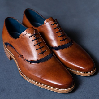 A Brown Pair of Plain-Toe Oxford Shoes