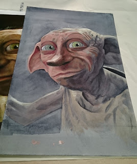 Putting the oil paint down over the underpainting of Dobby from Harry Potter. Artwork by Robin Springett