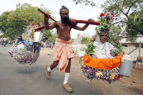 This `Sravan Kumar' of the 21 century is carrying his visually challenged mother on his shoulders on a `Char Dham' yatra by foot.