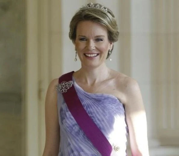 Queen Mathilde wore Natan Couture floral dress, Maison Natan dress, and Aramani blue one shoulder silk dress. Queen Fabiola's Wolfers tiara