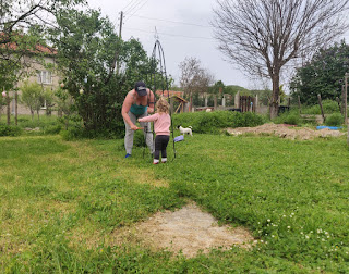 Rosie helping Angela assemble a plant frame