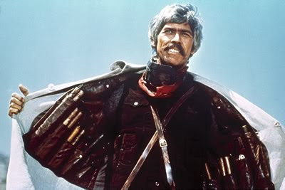 James Coburn as IRA dynamite expert and revolutionary John H. Mallory in Duck, You Sucker!, wearing dynamite jacket, Directed by Sergio Leone