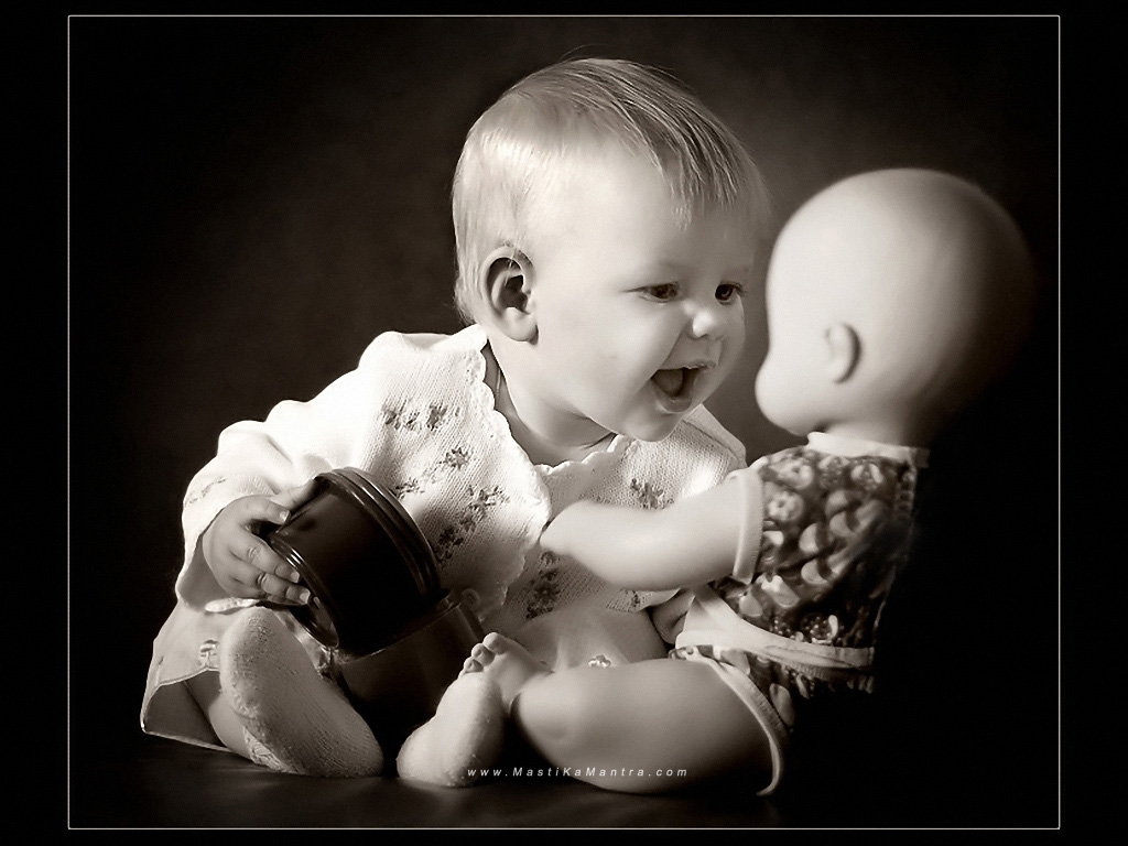 Cute baby boy playing with doll wallpapers