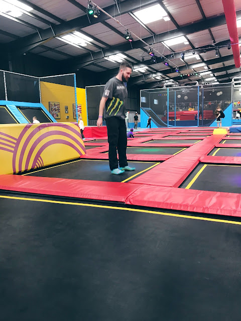 Daddy bouncing on a trampoline