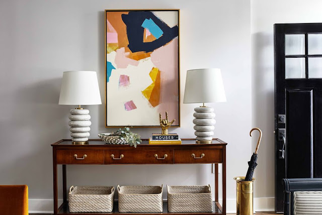 Jenny Prinn artwork and Kelly Wearstler stacked table lamps in entryway