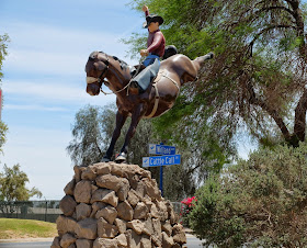 Photos of the statue at the entrance to the River Park / Cattle Call Arena