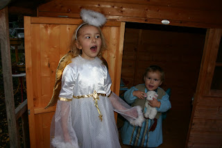 Top Ender dressed as an Angel with Baby Boy dressed as a shepherd singing Christmas Carols