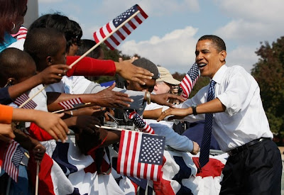 Obama greets some of the 100,000-strong crowd at a rally in St Louis, MO, October 18, 2008. 