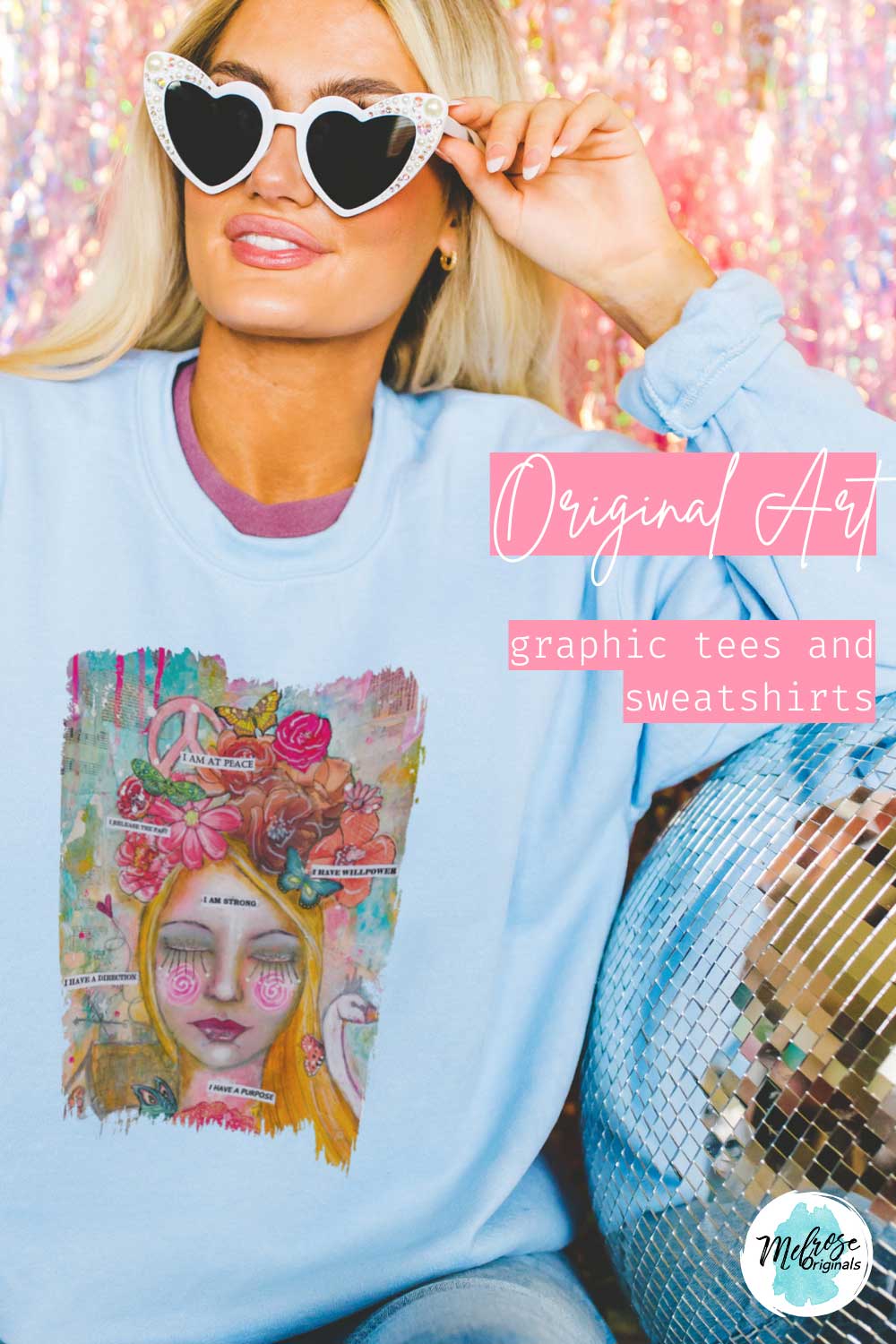 Fun stylish woman wearing a light blue whimsical girl graphic t-shirt