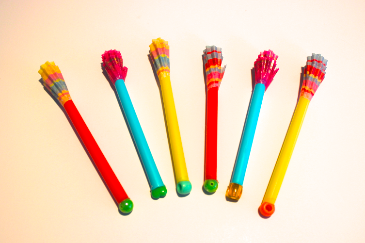 Easy to make homemade darts for kids...straws, cupcake wrappers, beads.