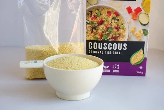 Couscous in a measuring cup.