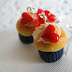 Blue lining cream cupcake with a tiny red heart polymer clay dangle
earring