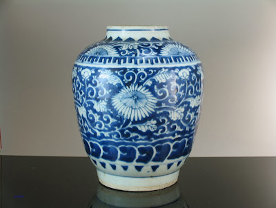 <img src="Chinese Transitional period Jar .jpg" alt="blue and white porcelain jar with floral decorations">
