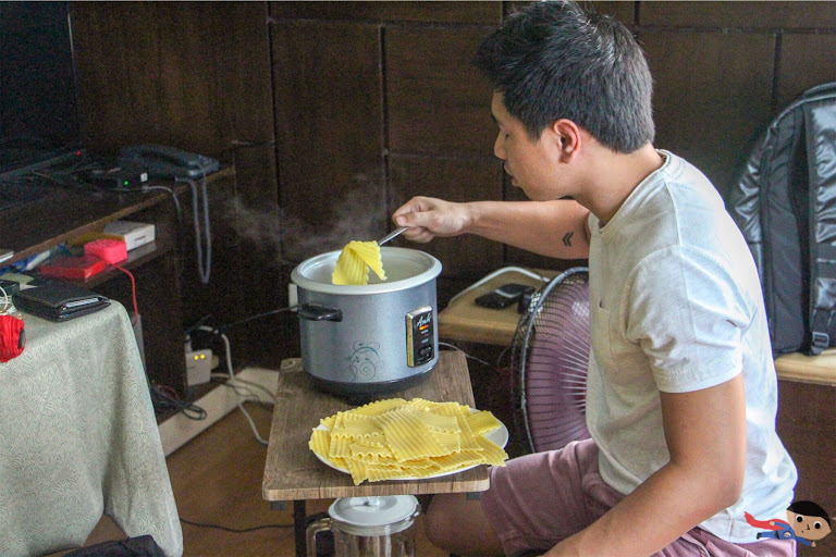 Alvin Francisco cooking the lasagna strips using a rice cooker