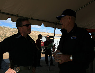 Gunny and Albuquerque Deputy Chief of Police Michael Castro talk under the scoring tent.