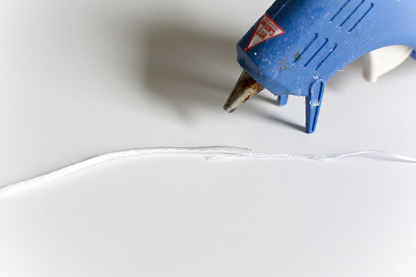 blue hot glue gun with white cord