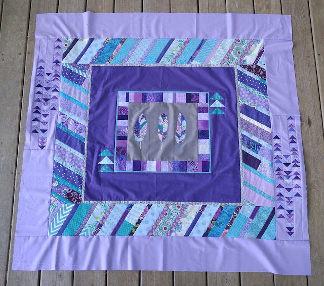 purple and aqua feather round robin quilt