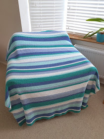 Beautiful cute and easy stripy crochet blanket.