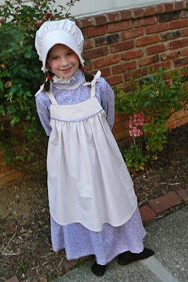 The little girl looks so cute in the pioneer day clothes