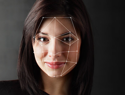 Photo showing a facial recognition scan of a woman's face.