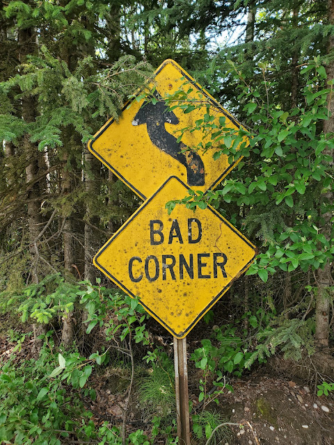 image of a road sign that says bad corner