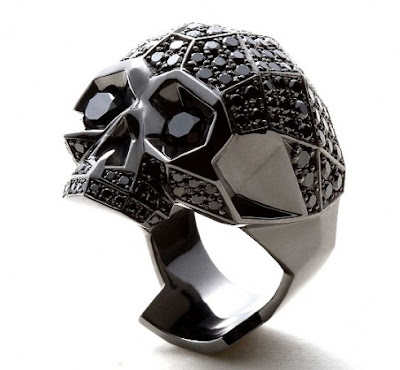 ... to your dark jewelry box this black diamond skull ring was created by