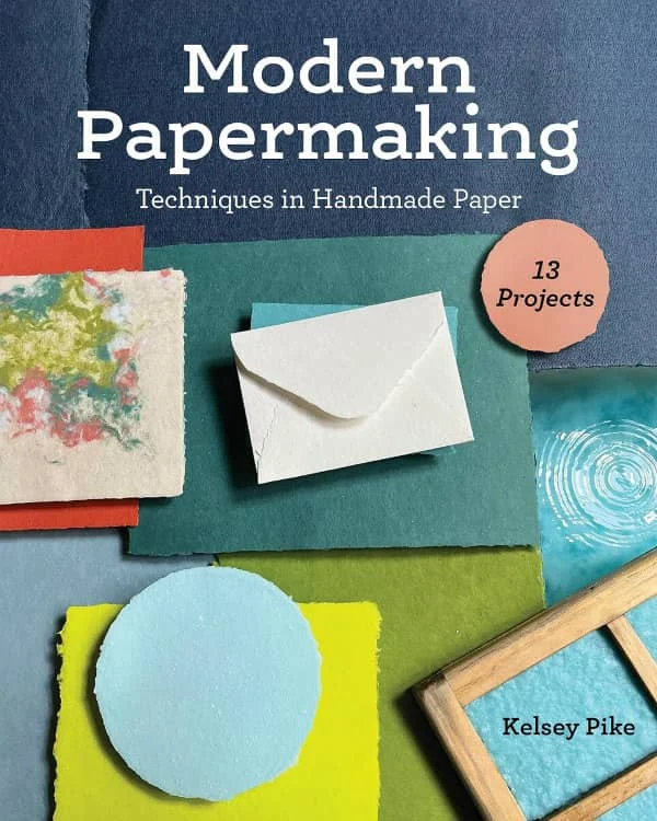 book cover shows examples of handmade paper in a varietyof colors, water bath and mold and deckle