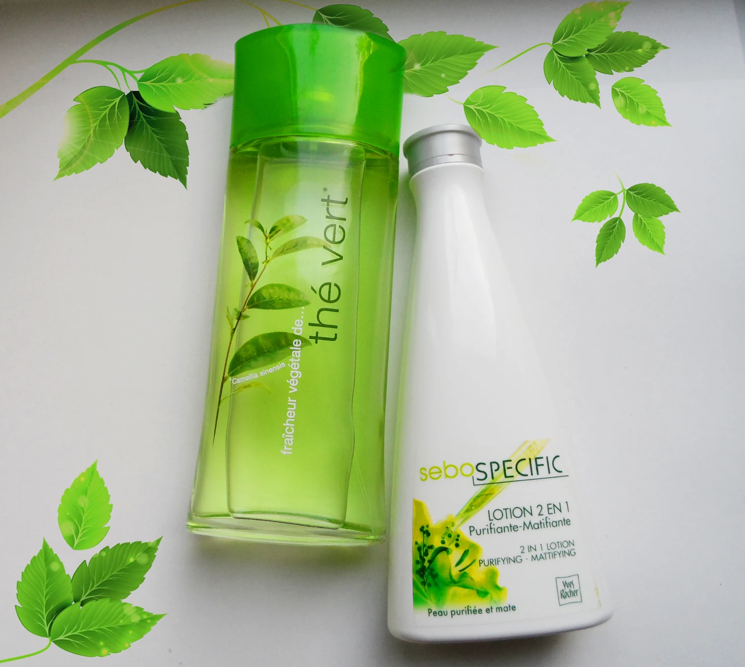 close-up shot of two beauty products: The Vert By Elizabeth Arden and Yves Rocher Toner on a white background