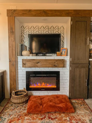 Faux mantel and brick wallpaper used in RV makeover