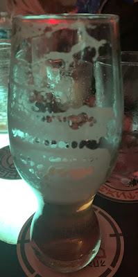 A partially drank pint of Gamorrean Ale