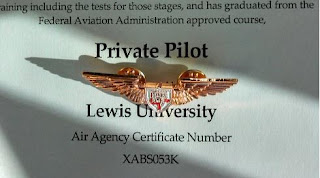 Joe Burlas receives his first pair of wings from Lewis University for earning his Private Pilots License