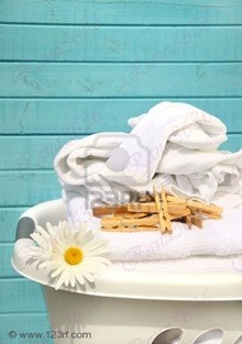 3338838-white-laundry-basket-with-folded-towels-and-socks