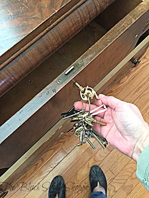 I keep a set of skeleton keys on hand. Luckily one of my keys fit the dresser.