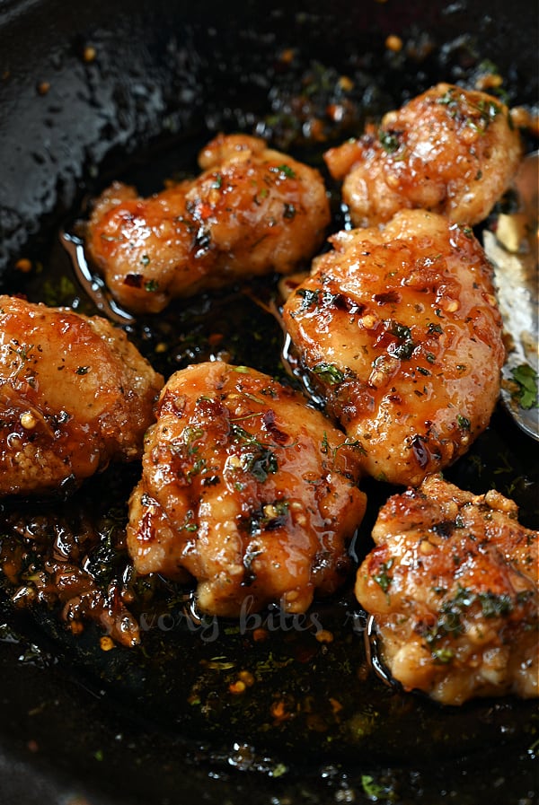 a close up of a pan with honey garlic chicken thighs