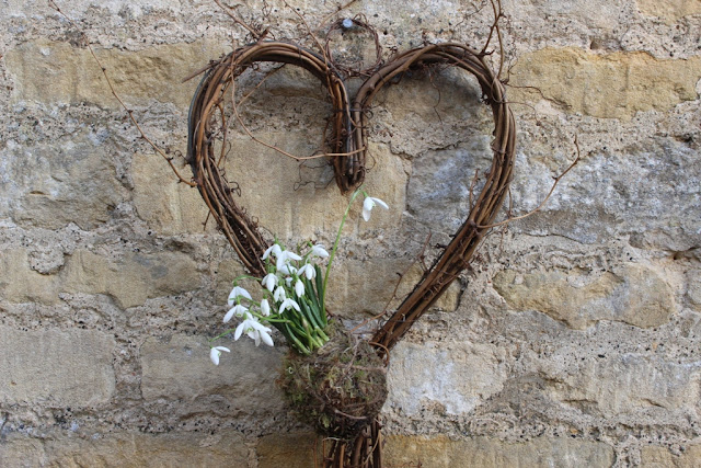 A simple woven heart with snowdrop kokedama makes a cute Valentine