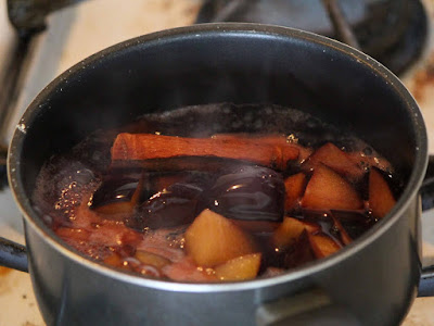 Plum, honey and red wine sauce simmering on the stove