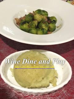 With entrees at Compass Grille are the Brussel sprouts and mashed potato sides