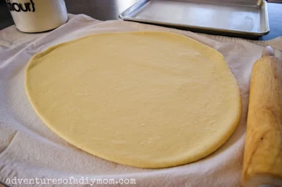 donut dough rolled out and ready to cut